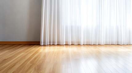 Soft curtain panel drapes gently above polished wooden floor in warm, cozy light during a serene morning