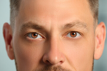 Closeup view of man with brown eyes