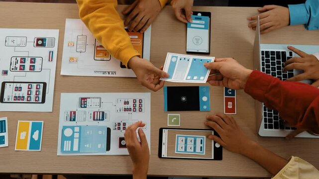 Top view panorama video of startup company employee planning on user interface prototype for mobile application or website in office. UX UI designer brainstorm user friendly interface plan. Synergic