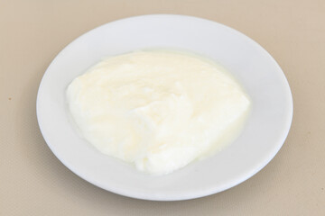 Delicious yogurt scene with Casserole bowl. Closeup shot of healthy fresh yogurt. Karisik kizartma. Top view.