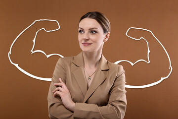 Confident businesswoman with drawing of strong arms behind her on brown background
