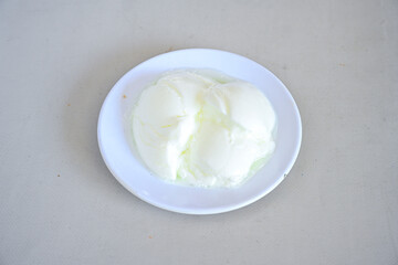 Delicious yogurt scene with Casserole bowl. Closeup shot of healthy fresh yogurt. Karisik kizartma. Top view.