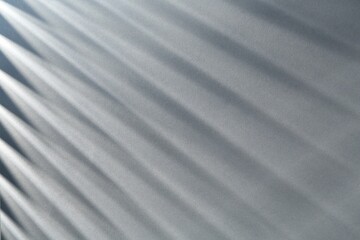 Obraz premium Light and shadows falling on grey background