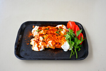 Meat, chicken shawarma kebab with yogurt and fried butter sauce .Tantuni Special. Yogurtlu tantuni.