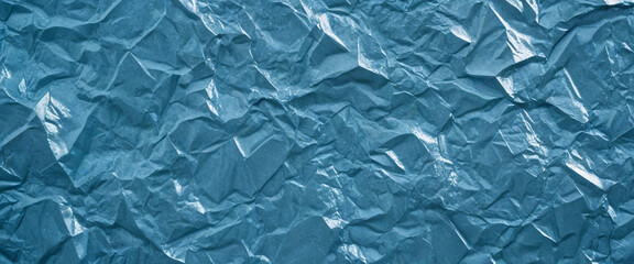 Obraz premium Close-up of crumpled sky blue metal texture with a shiny, metallic, icy surface