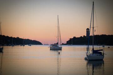 Still photo of a sailboat during golden hour sunrise in Halifax, Nova Scotia
