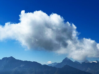 Beautiful photogenic clouds over the Uri Alps massif in the Swiss Alps, Melchtal - Canton of...