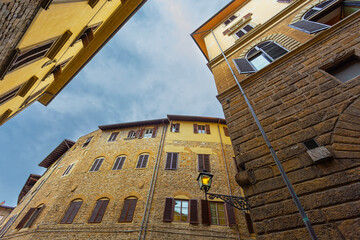 View of the  street and old medieval houses at historic center of Florence, Tuscany, Italy.