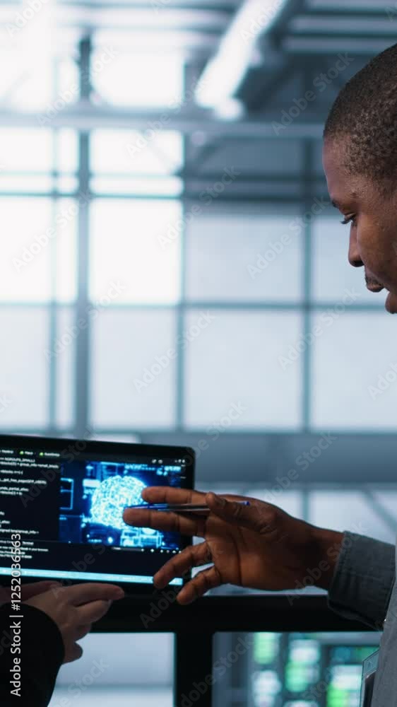 Poster vertical video software developers in data center use ai technology on tablet to optimize storage vo