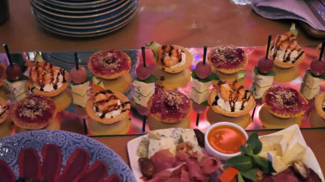 beautifully decorated banquet table with appetizers canapes. buffet for the holiday