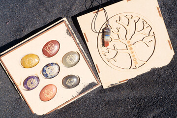 Pendulum obelisk with chakra healing crystals. Witchcraft, herbal medicine and healing, Magic...