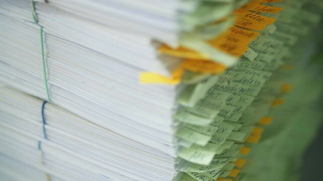Stack of documents with notes
