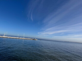 Obraz premium pier in the sea, celestial abstraction 