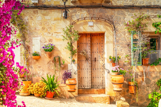 Fototapeta wall with traditional flower pots in old town of Valdemossa, Majorca, Spain