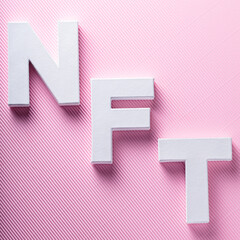 Non-Fungible Token on Pink Background, Top View