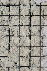 Texture of Handmade Paper on a black metal grid