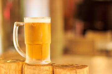cold draft beer in mug at bar