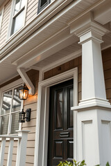 Elegant Home Exterior: Modern Architecture and Classic Design.  A stunning front door and porch with white columns, showcasing exquisite architectural details.