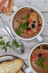 Vegan beet greens and potato creamed soup in a rustic setting