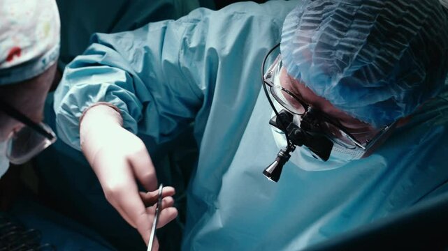 Close-up of a surgeon in the operating room. Concept: focus and precision during a complex procedure. Perfect for medical and educational projects.