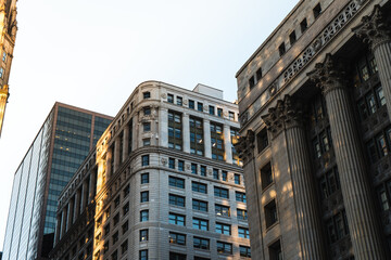 Historic and modern architecture in downtown Chicago, neoclassical columns, ornate facades, glass skyscraper, urban, city skyline, commercial real estate, business hub, classic and contemporary design