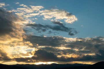 Glowing Clouds at Sunset Over Rocky Mountains