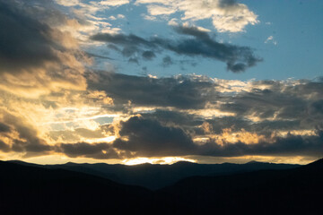 Glowing Clouds at Sunset Over Rocky Mountains