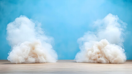Fluffy clouds on wooden surface, blue backdrop, product display