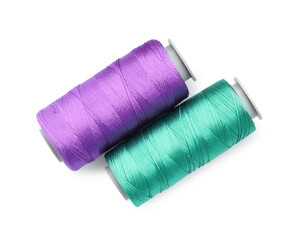Spools of bright sewing threads isolated on white, top view
