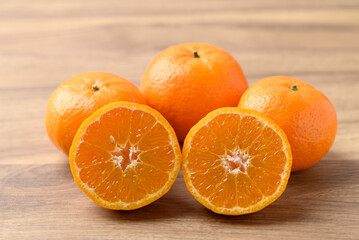 Mandarin tangerine orange fruit on wooden background