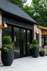 Elegant exterior of a modern stone building showcasing beautiful landscaping and stylish copper fixtures in a serene, green environment