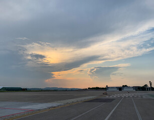 sunset on the runway, clouds