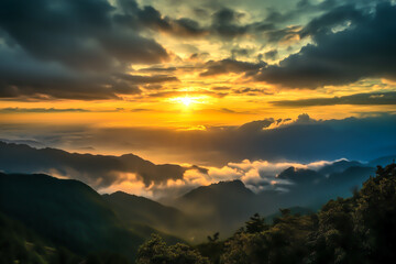 Obraz premium Majestic sunrise over misty mountain peaks with vibrant golden and orange hues illuminating the clouds. Concept of tranquility, inspiration, and natural wonder.