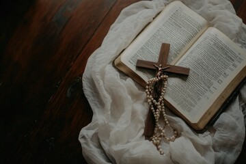 Wooden cross, rosary, bible on table. Faith, spirituality, prayer concept