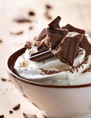 Shaving Dark Chocolate Over a Bowl of Whipped Cream