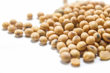closeup of pile of soybeans isolated on white background