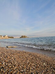 View of the seaside and Hymettus or Hymettos, a mountain range in the Athens area of Attica, from the Votsalakia beach, Piraeus, Greece