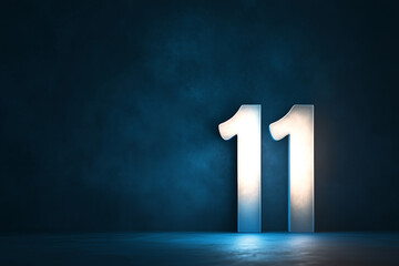 A pearl white number 11 on a deep indigo background, softly illuminated with a hint of shadow for depth.