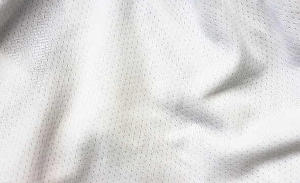 White sports clothing fabric jersey football shirt texture top view close up