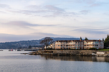 Scenic Waterfront Residential Complex With Mountain Backdrop and Tranquil Bay
