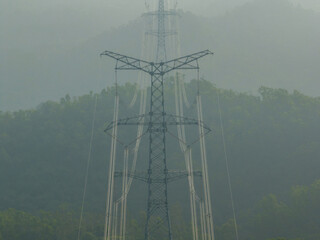 Aerial view of high voltage electricity tower on mountain