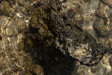 Natural beach rocks at the tropical sea