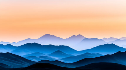 Obraz premium Sunrise over a misty mountain range; serene landscape view; peaceful scene; potentially for wallpaper or screensaver