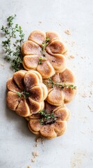 Pumpkin-shaped cookies with duck pt and thyme on a rustic surface