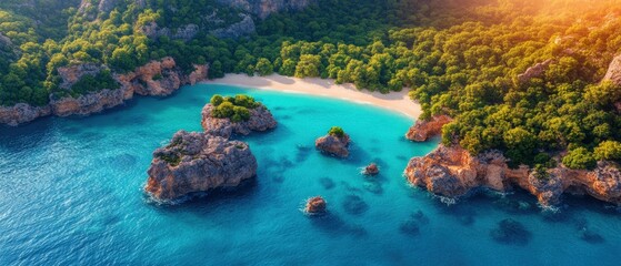 Aerial view of a beach and lagoon with rocky coastline and clear blue sea in high resolution