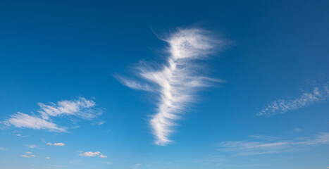 Panorama Clouds are streaks and blue sky.Flushed, fluffy white clouds scatter in full light clear sky.
