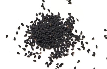 Black cumin seeds pile isolated on white background