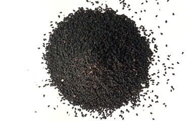Black cumin seeds pile isolated on white background