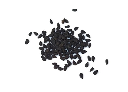 Black cumin seeds pile isolated on white background