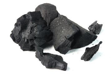 Close-Up of Black Charcoal Pieces Isolated on White Background